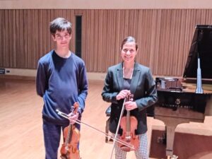 Two students with violins